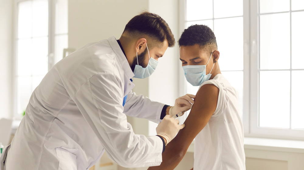 man receiving vaccine shot