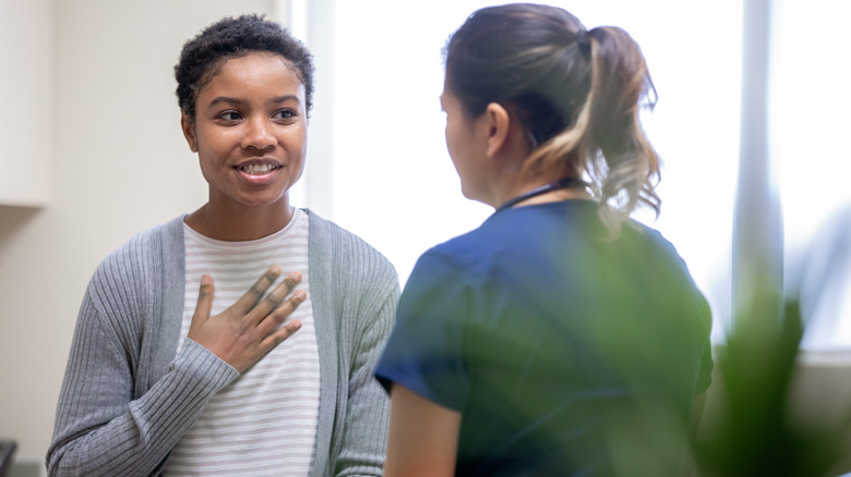 Woman talking with a doctor