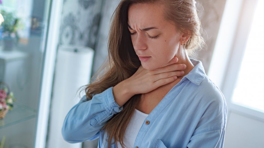 A woman suffering from an allergic reaction