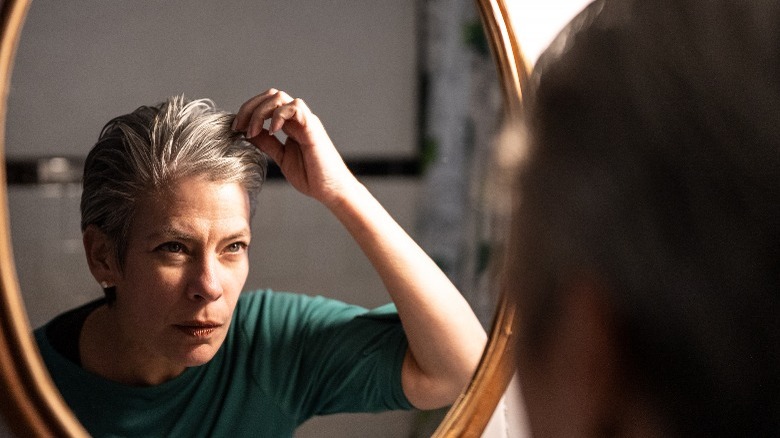 Woman looking at her hair