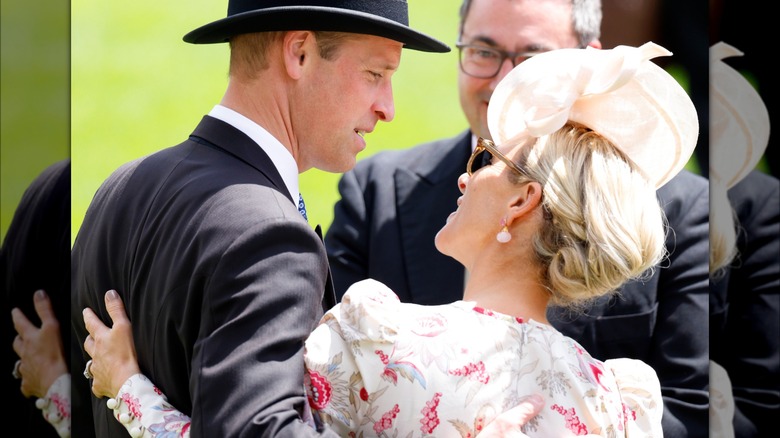 Prince William looking at Zara Tindall