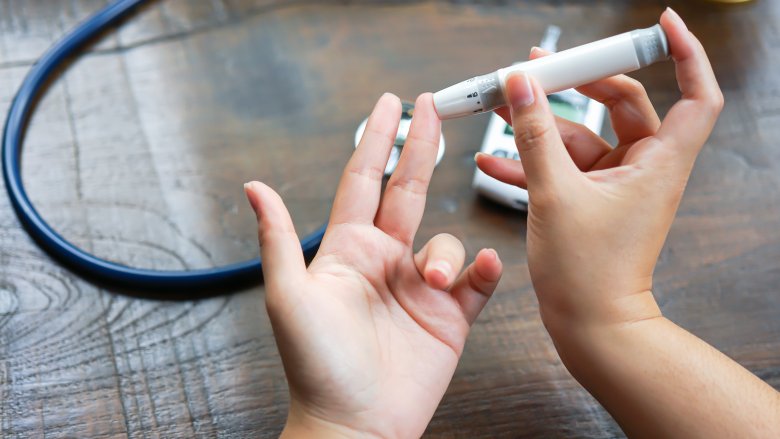 Woman checking blood sugar