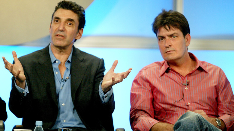 Chuck Lorre and Charlie Sheen addressing an audience