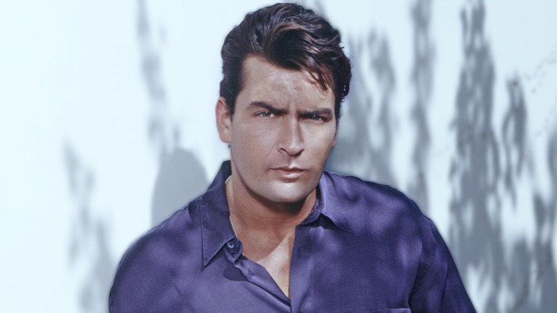 A young Charlie Sheen looking serious