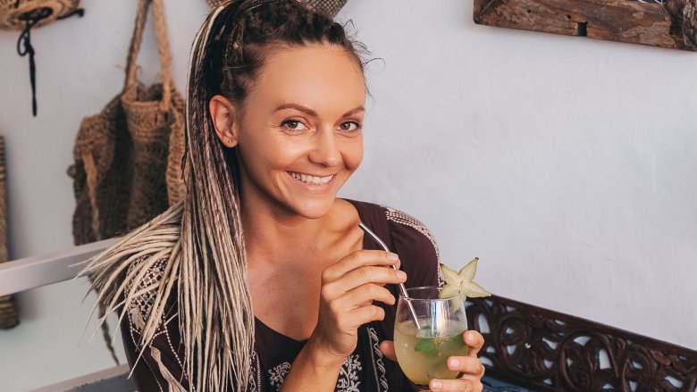 woman stirring Kombucha