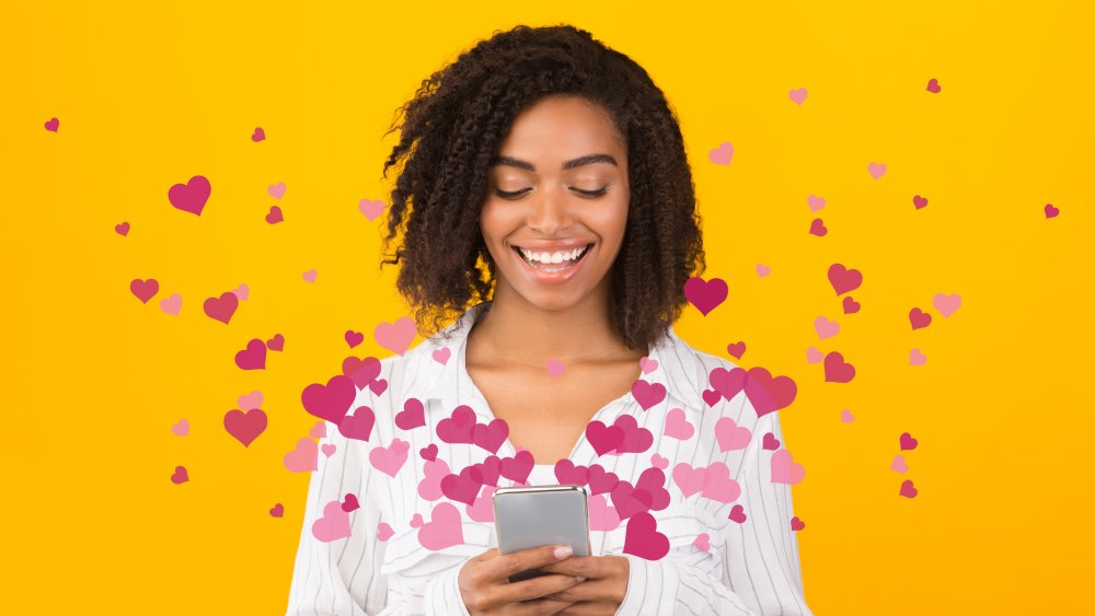 Woman with hearts and phone