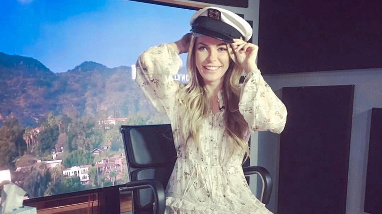 Crystal Harris wearing Hugh Hefner's captain hat