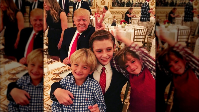 Barron Trump hugging two of his nephews