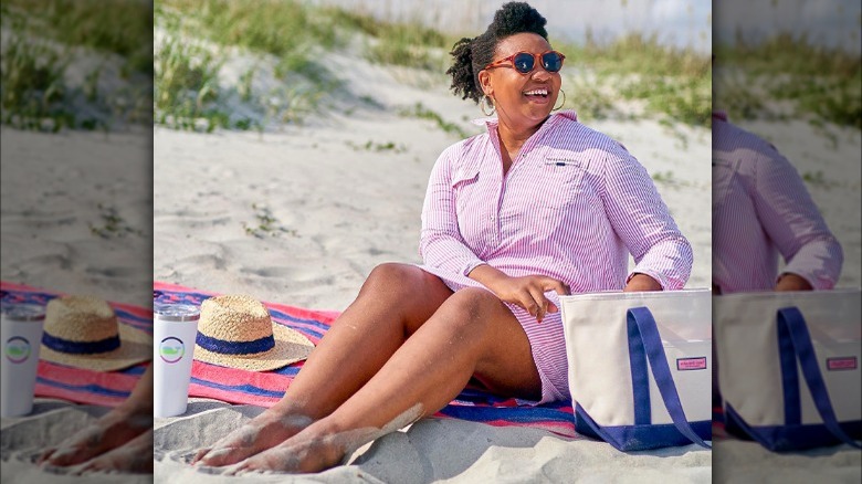 Model at beach in striped shirt dress