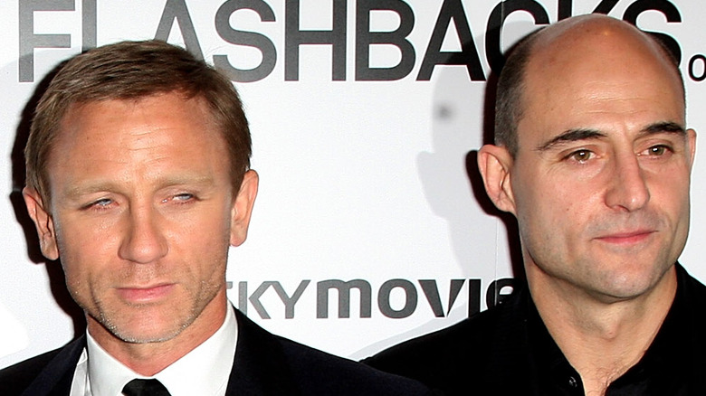 Daniel Craig and Mark Strong attend an event