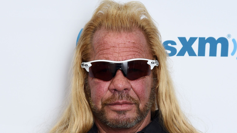 Dog the Bounty Hunter poses on the red carpet