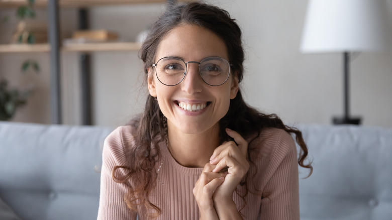 Woman wearing eyeglasses and smiling