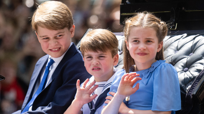 Prince George, Princess Charlotte, and Prince Louis waving