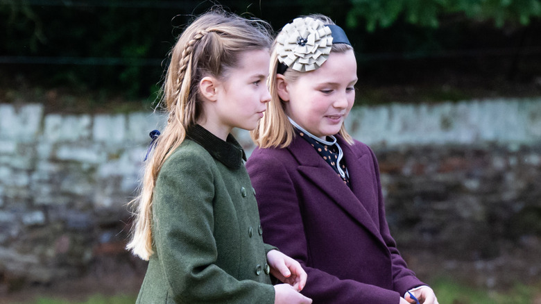 Princess Charlotte and Mia Tindall walking