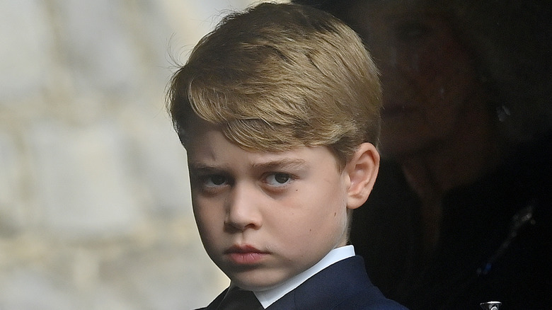 Prince George frowning