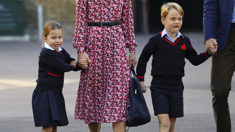 Prince George and Princess Charlotte walking with their parents