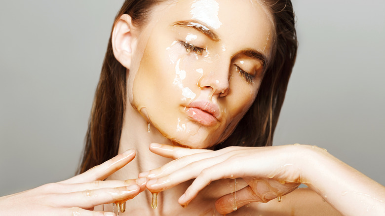 Woman with honey covered face