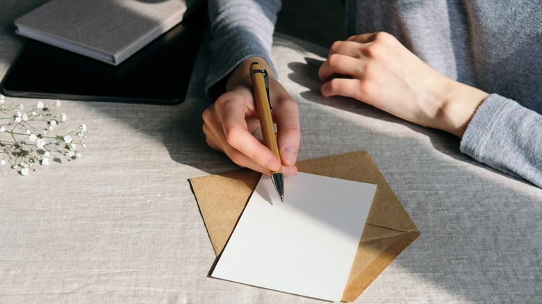 Woman writing romantic card