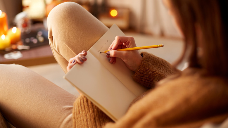 woman writing in journal