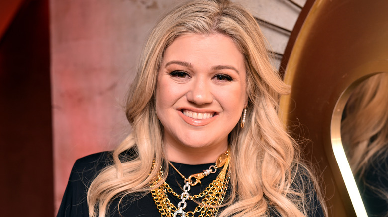 Kelly Clarkson smiling at an event