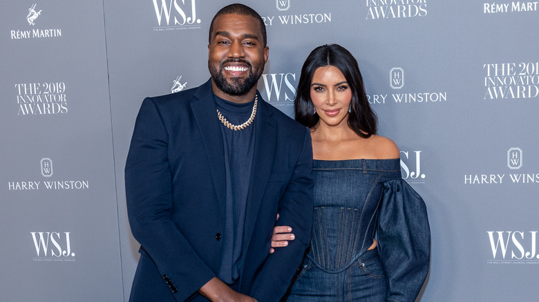 Kim Kardashian and Kanye West smiling