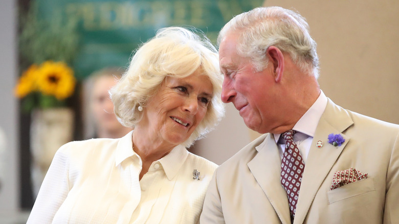 King Charles and Queen Camilla looking fondly at each other