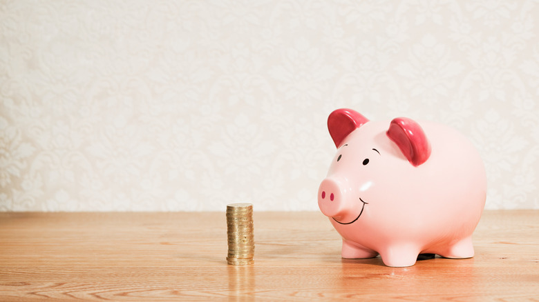 Piggybank, stack of coins