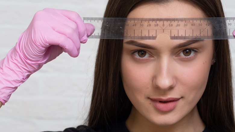 Woman's eyebrow shape assessed