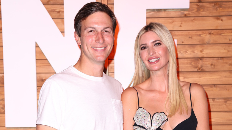 Jared Kushner and Ivanka Trump posing at event