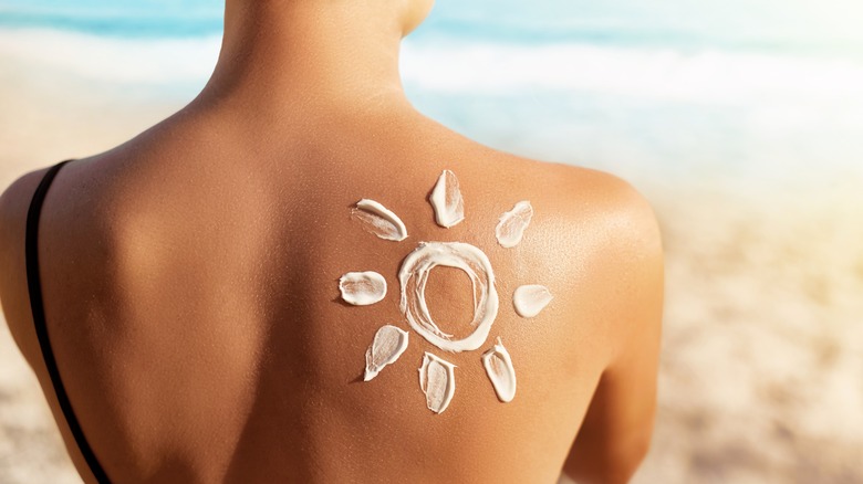 woman's back with sunscreen