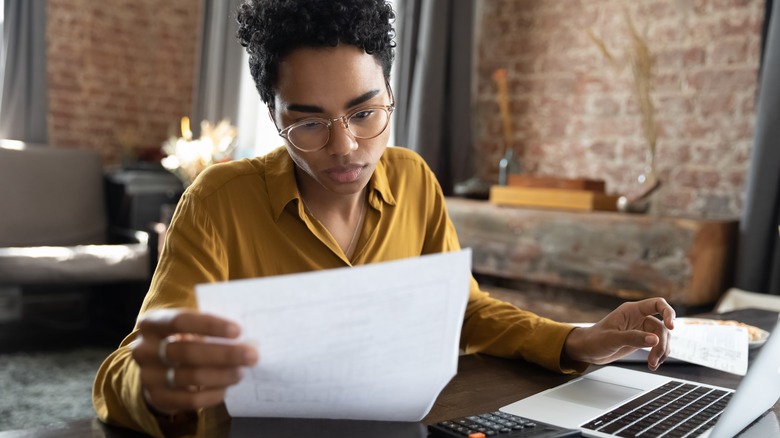 woman looking at papers