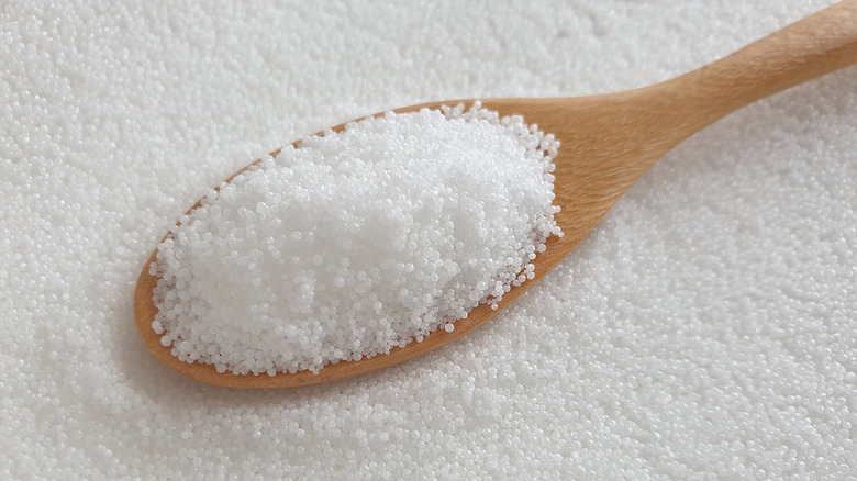 wooden spoon holding stearic acid