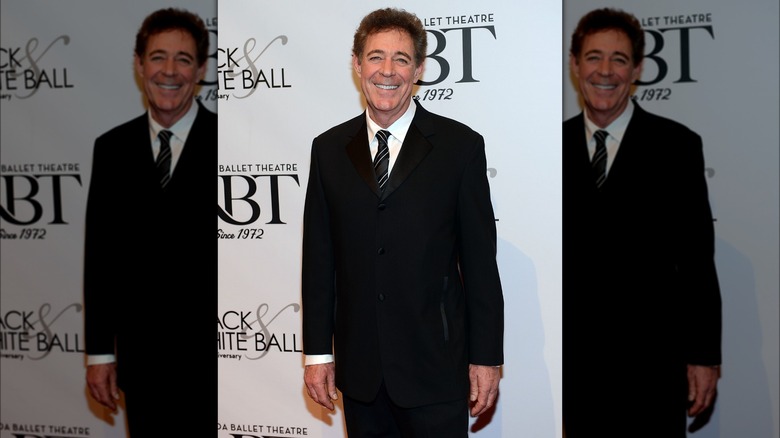 Barry Williams in black suit