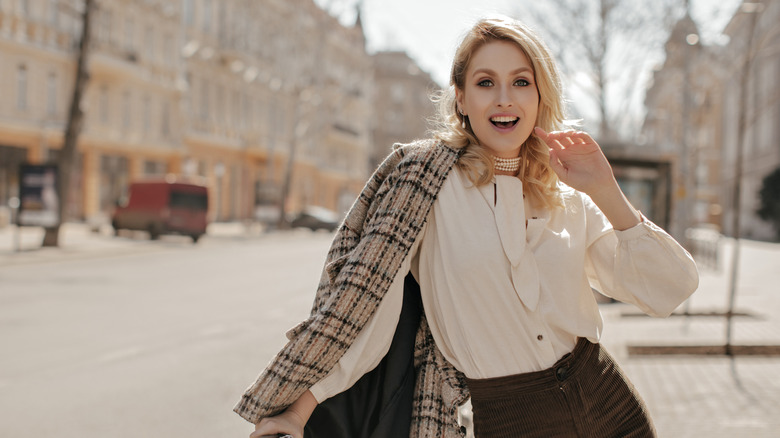 Woman dressed in light academia aesthetic 