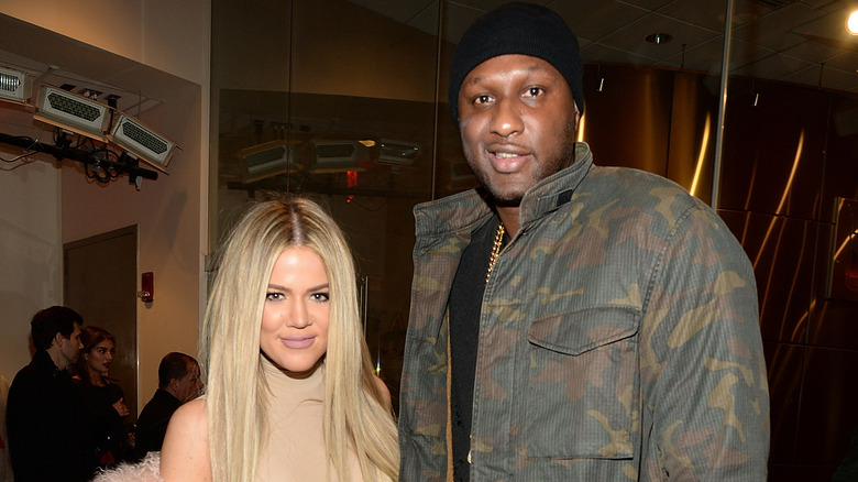 Khloe Kardashian and Lamar Odom at an event.