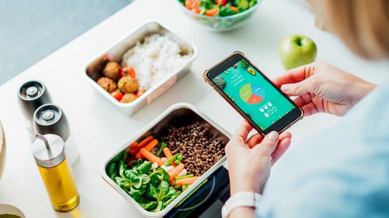 Woman tracking meals on phone