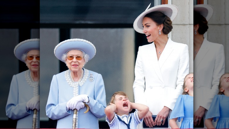 Queen Elizabeth looking stoic as Prince Louis yells with hands over his ears and Kate Middleton talks 