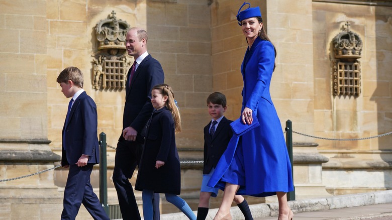 The Wales family walking to church