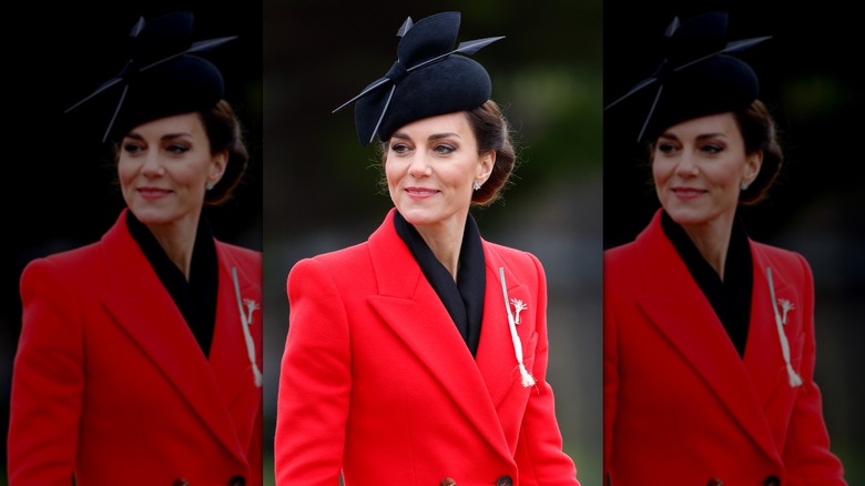 Princess Catherine wearing red coat and black hat