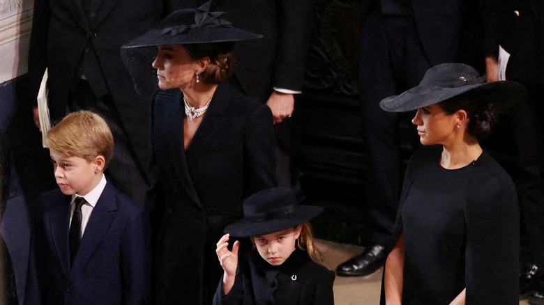 Princess Catherine, Meghan Markle, Prince George, and Princess Charlotte at queen's funeral