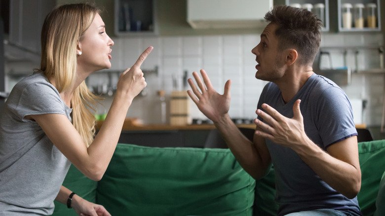 Couple arguing on a couch