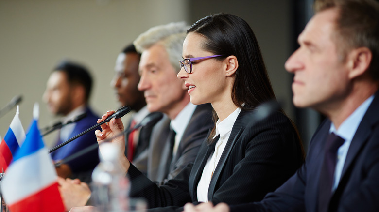 Female political figure speaks at an event