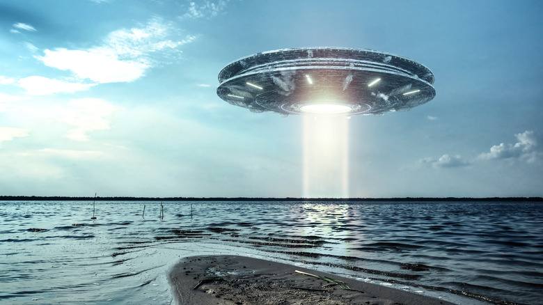 Alien spaceship over water