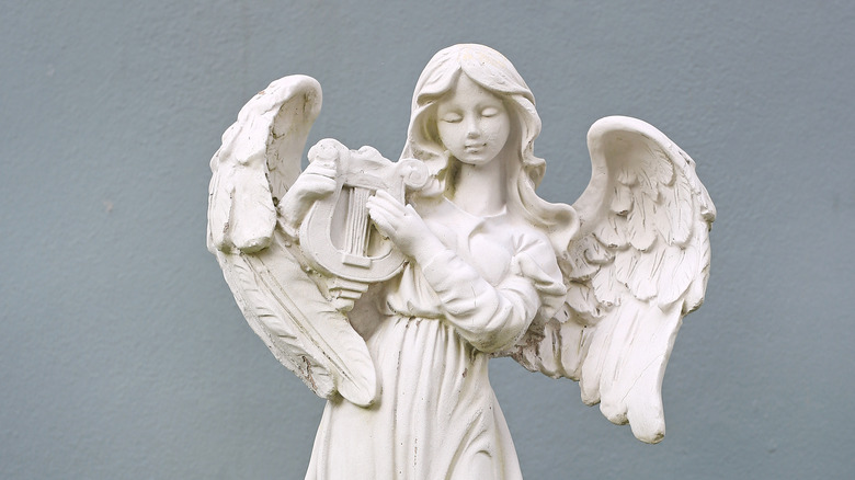 Old statue of angel with harp