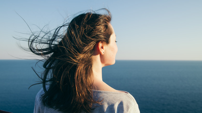 Woman looking out to sea