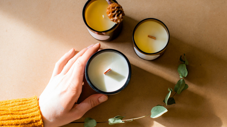 Woman cusping a candle