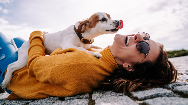 Dog with woman laughing