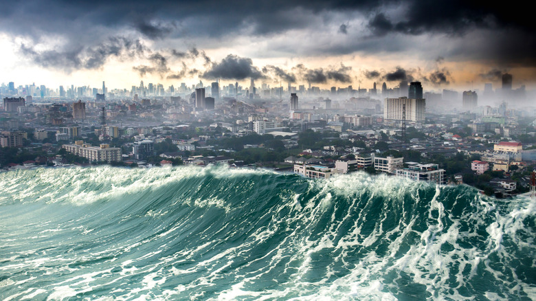 Tsunami waves crashing into a city