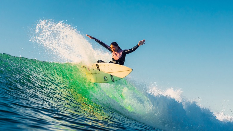 A woman on a surfboard