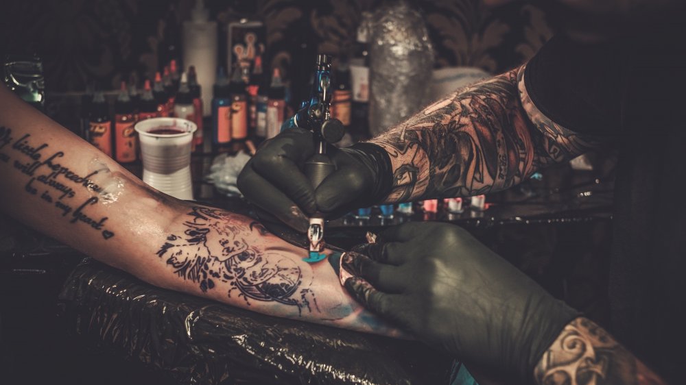 Woman getting a tattoo